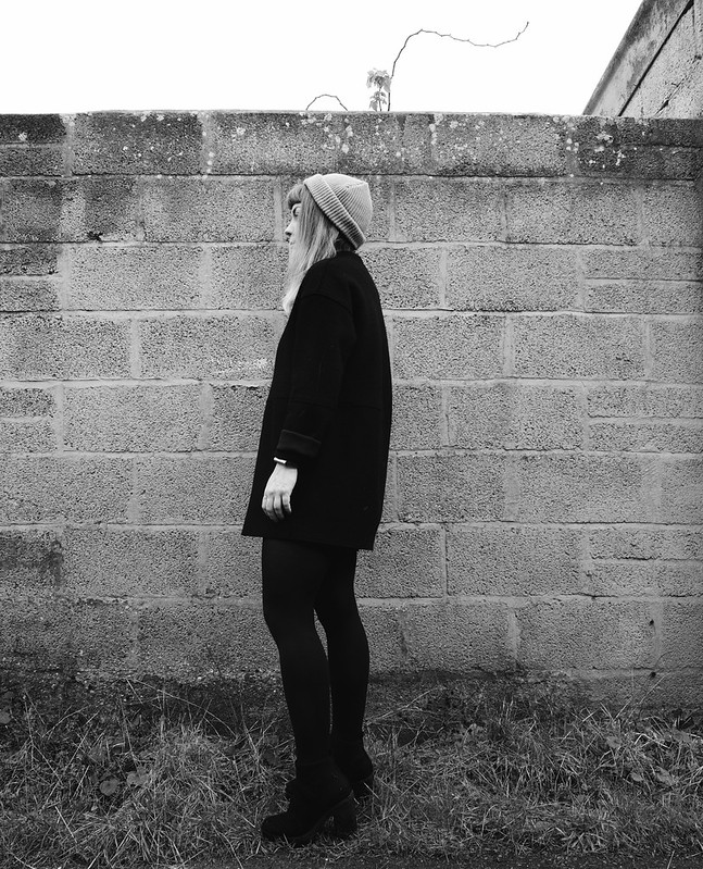 black winter outfit : being little. black wool raw edge coat cos minimal black monochrome fashion blog blogger outfit