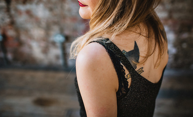 Lyzi Unwin at The Forge, Bristol. Photographed by Lauren Jayne Hall. lyzi unwin being little the forge bristol lauren jayne hall photographer cat tattoo tattoos rose rebecca vincent brick wall red lips
